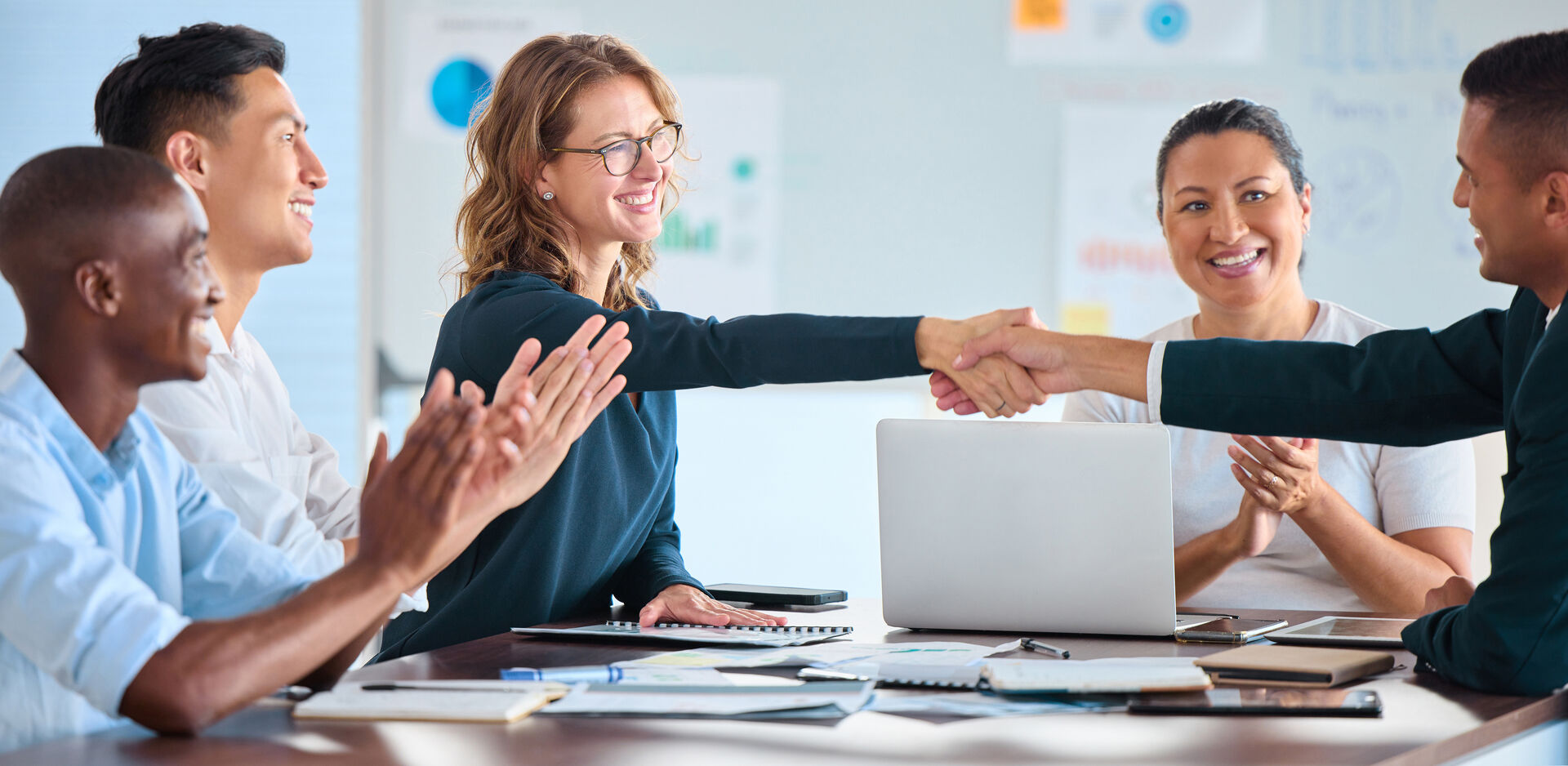 Business people shaking hands during a collaborative meeting