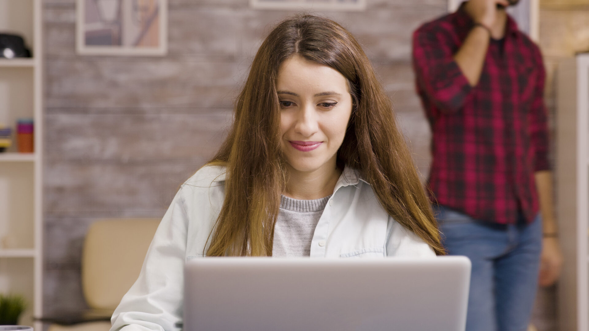 Girl enjoying a cup of coffee while working from home