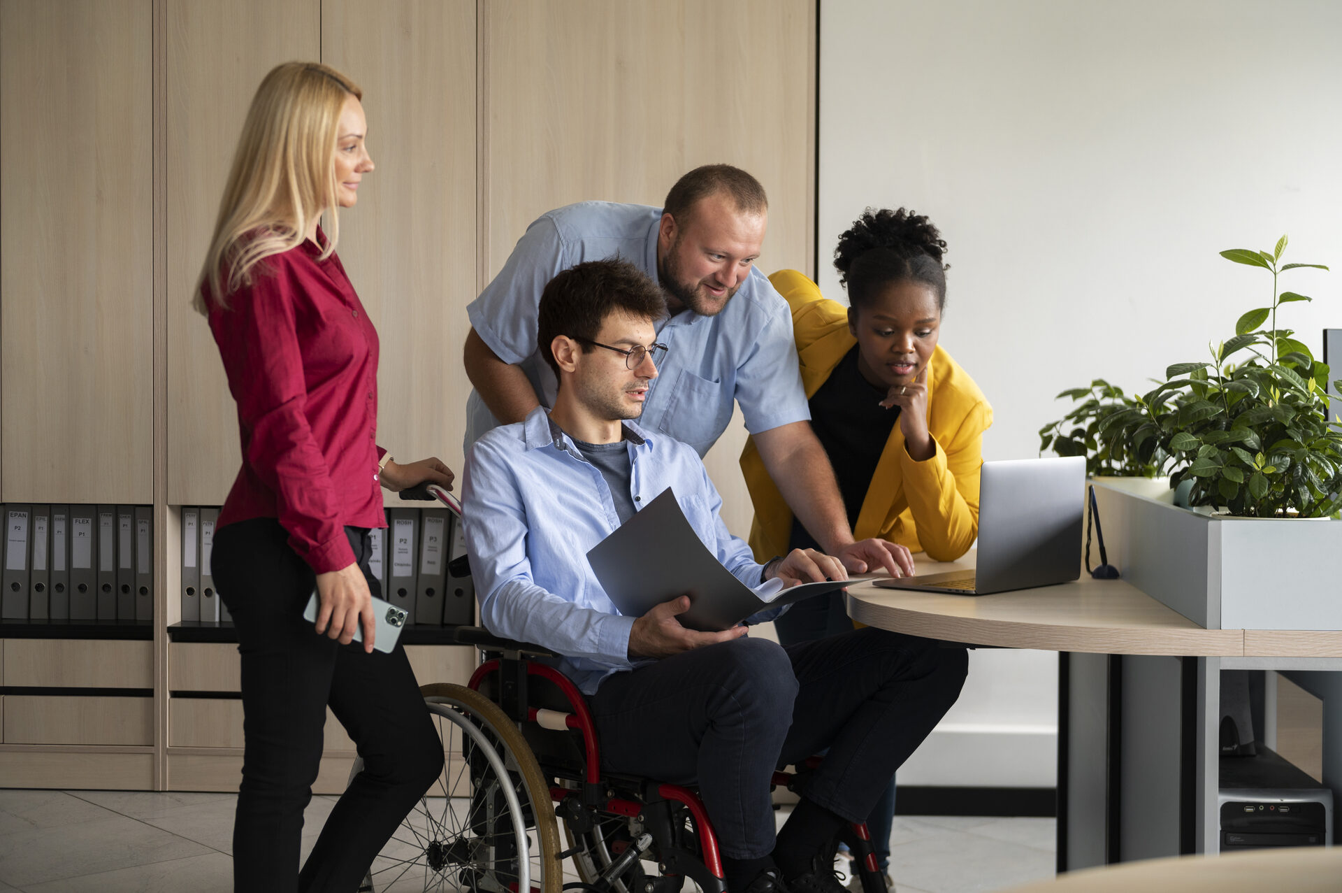 Side view of people working in an office