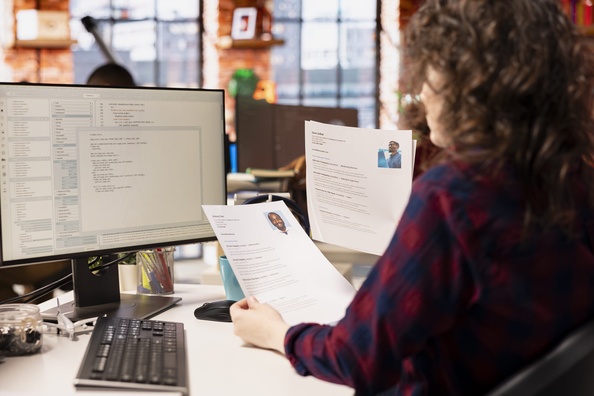 Office worker analyzing candidate CV